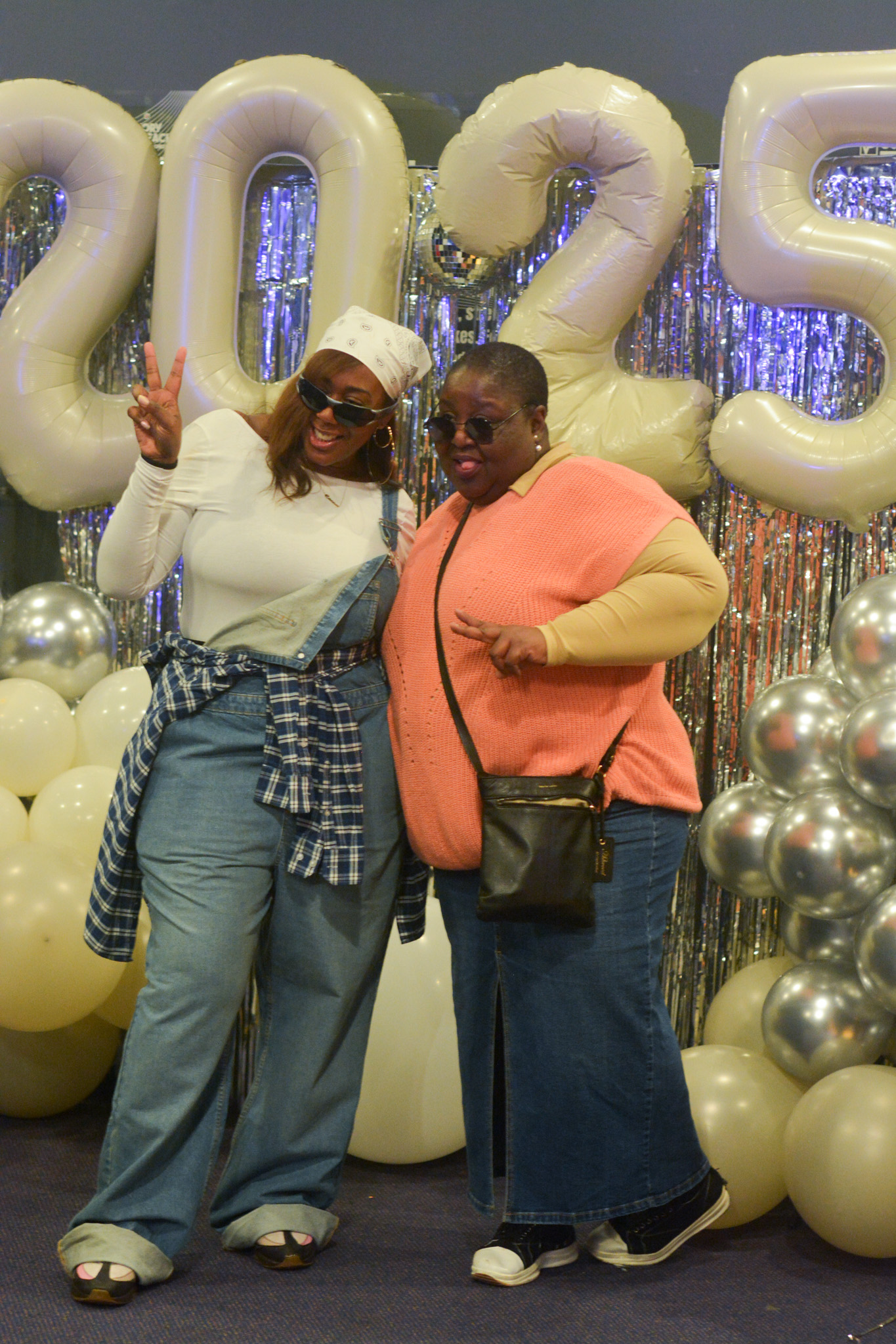 Stylish attendees celebrate milestone event in Victory Outreach Manchester's festive function hall.