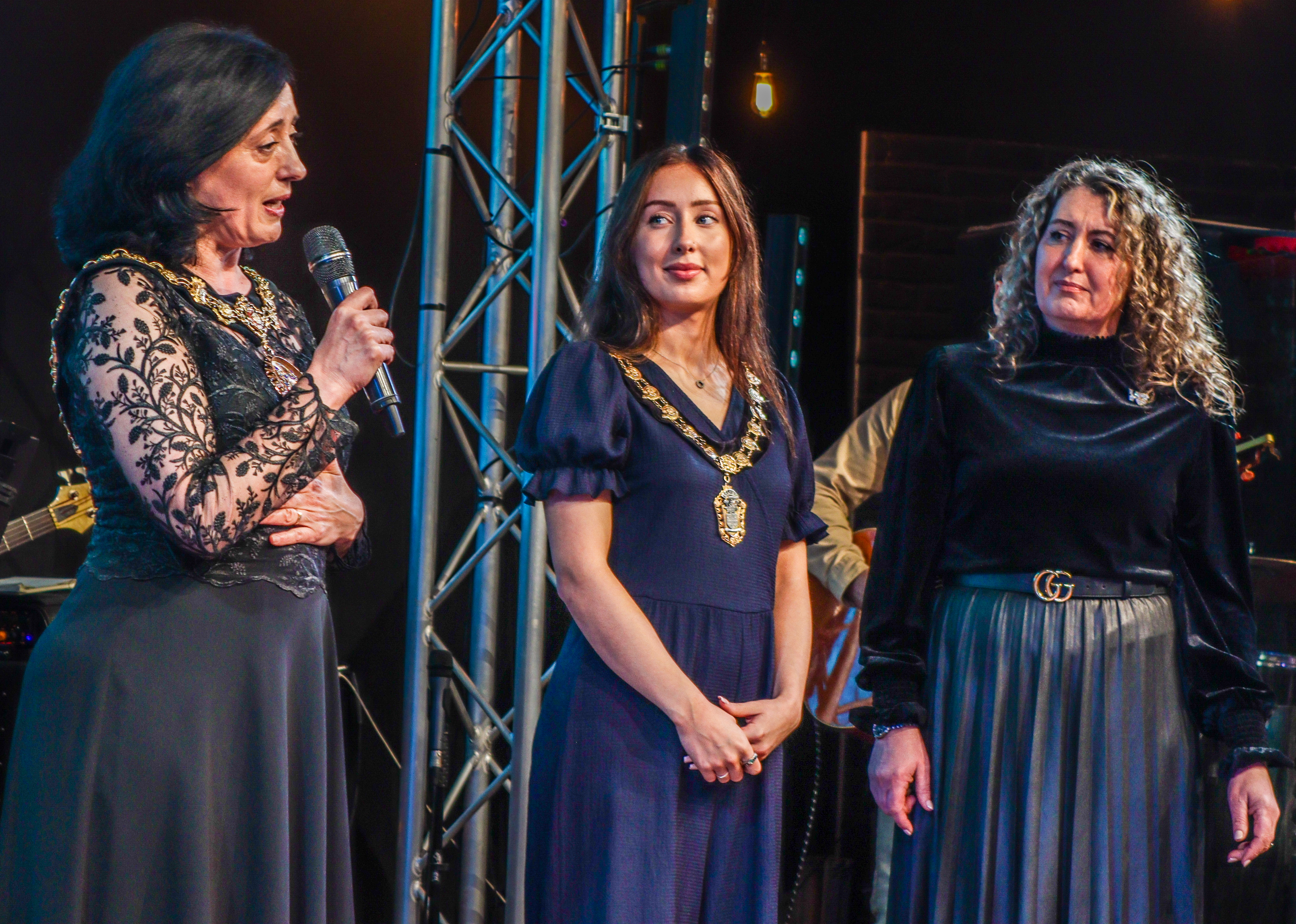 Awards ceremony at Victory Outreach Manchester, featuring women speaking on stage.