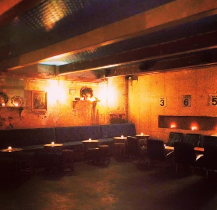 Intimate lounge at Farrs Dalston with banquet seating for networking events and VIP parties.