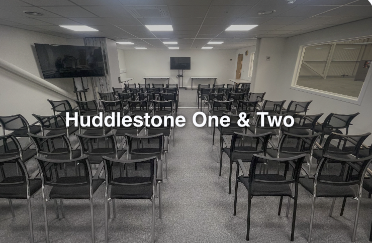 Versatile meeting rooms with black chairs, ideal for workshops and seminars.