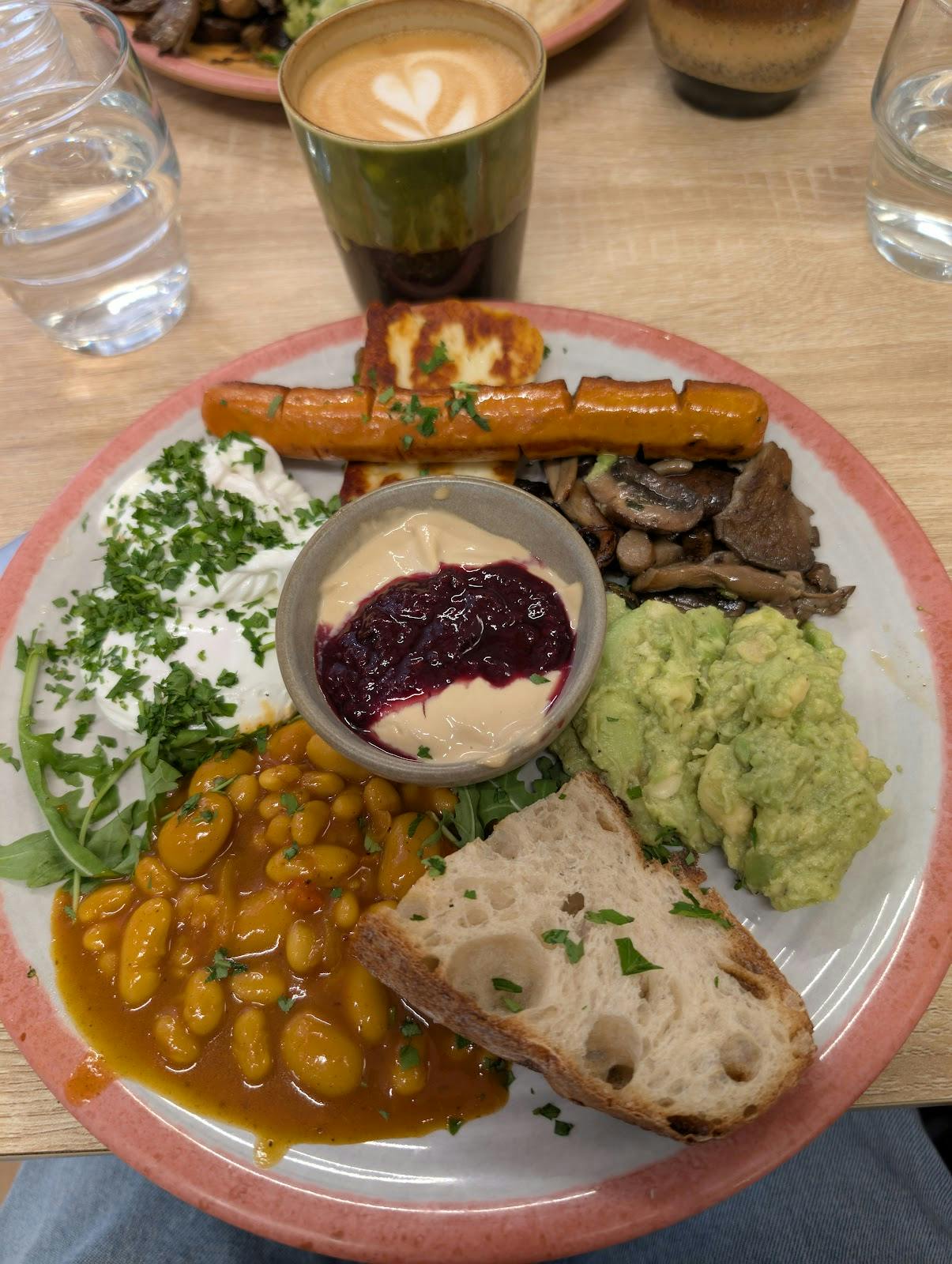 Upscale vegetarian breakfast with avocado and halloumi for corporate catering events.