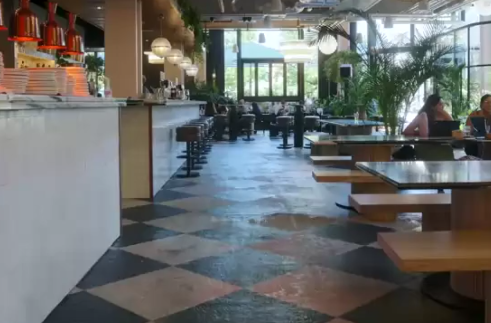 Modern event space at Mare Street Market with communal tables for networking and conferences.