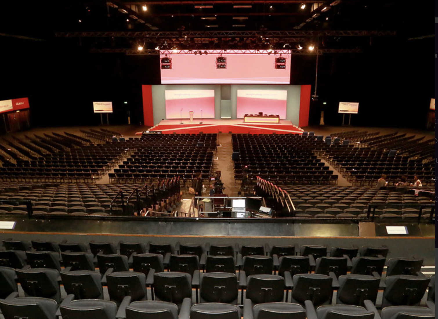 Brighton Centre spacious venue for conference with stage, optimal seating & AV setup.
