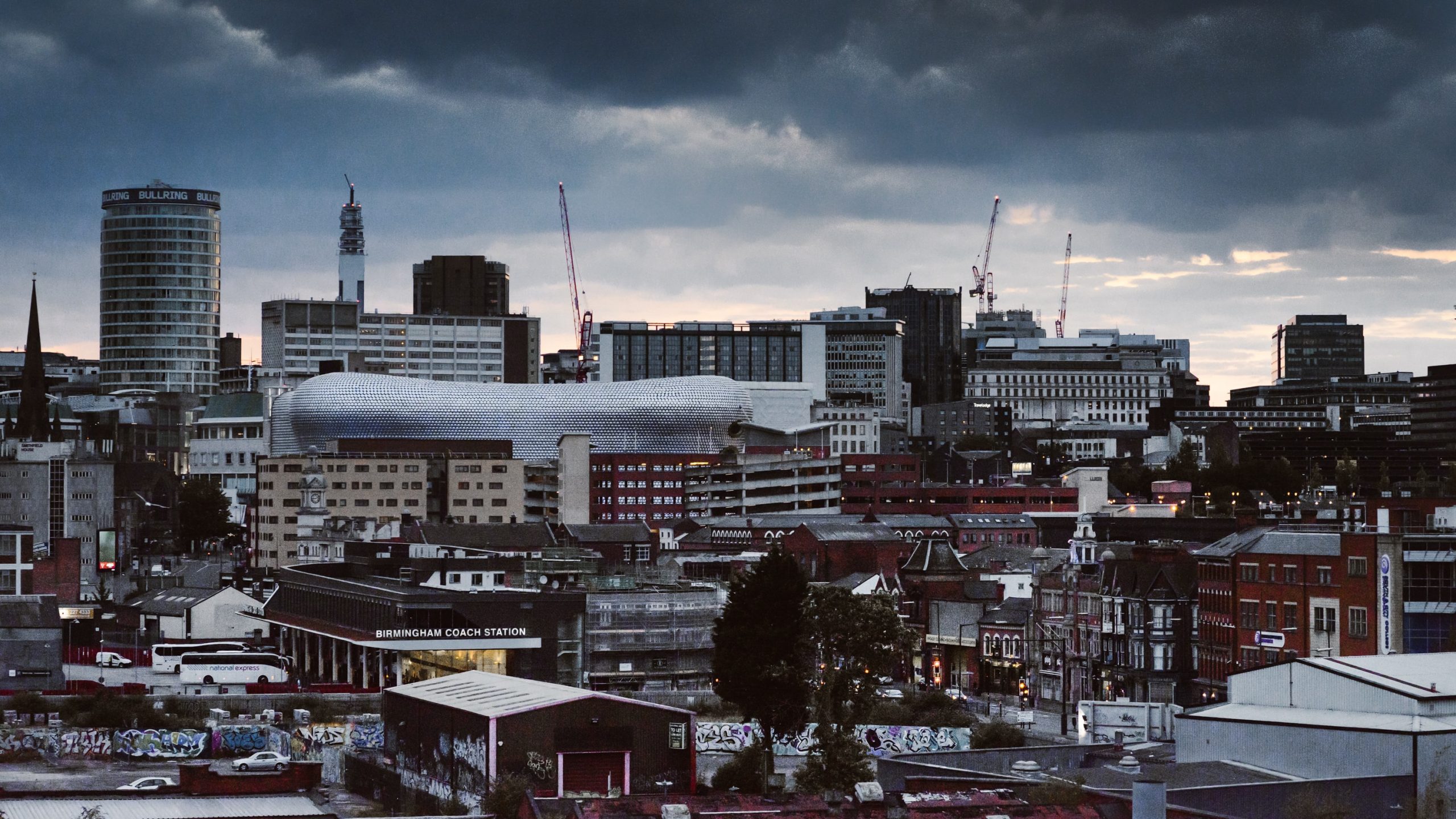 Modern church meeting room with urban skyline view for corporate events and workshops.