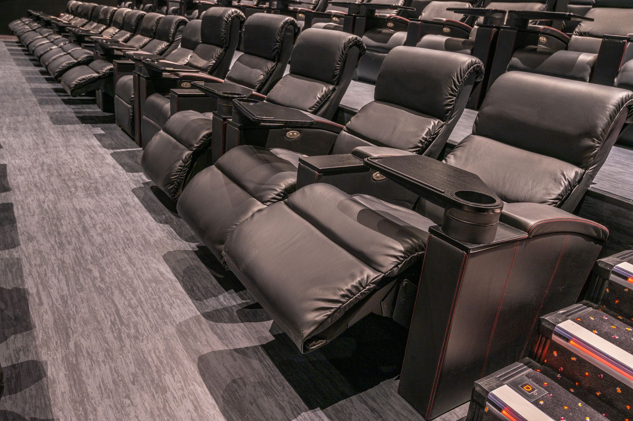 Luxury Vue Glasgow cinema screen with plush recliner seating for corporate events and seminars.