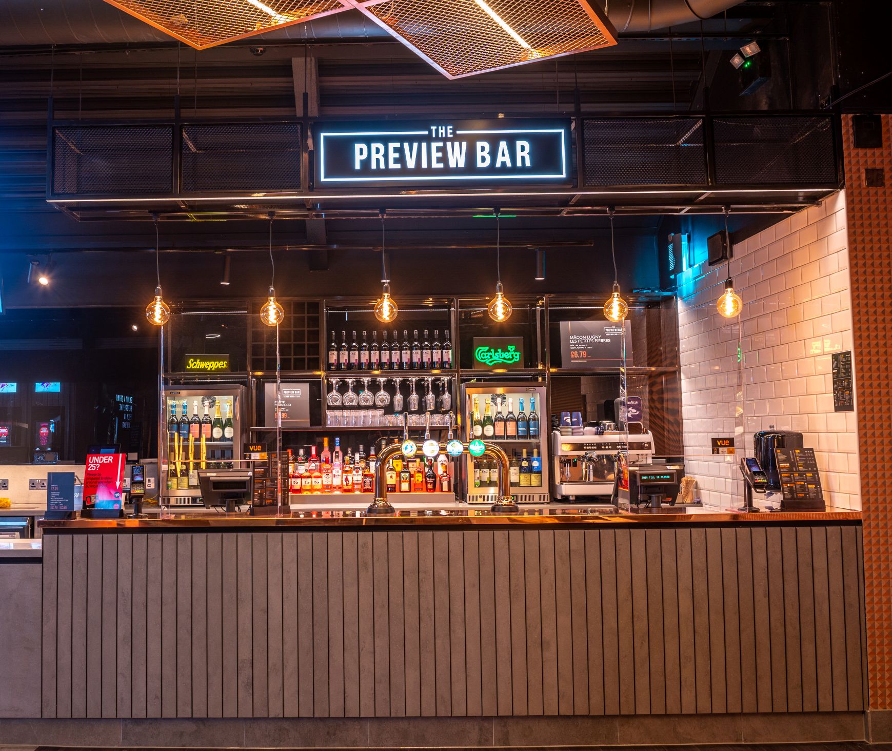 Industrial-chic satellite bar at Vue Glasgow for corporate events and networking receptions.