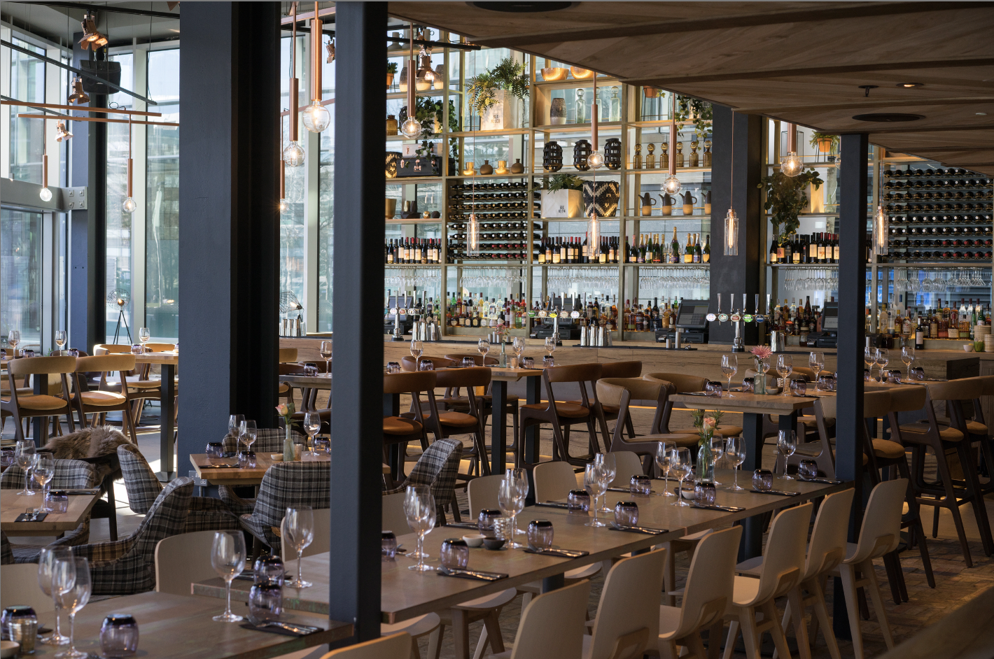 Modern restaurant venue with natural light, ideal for corporate events and networking receptions.