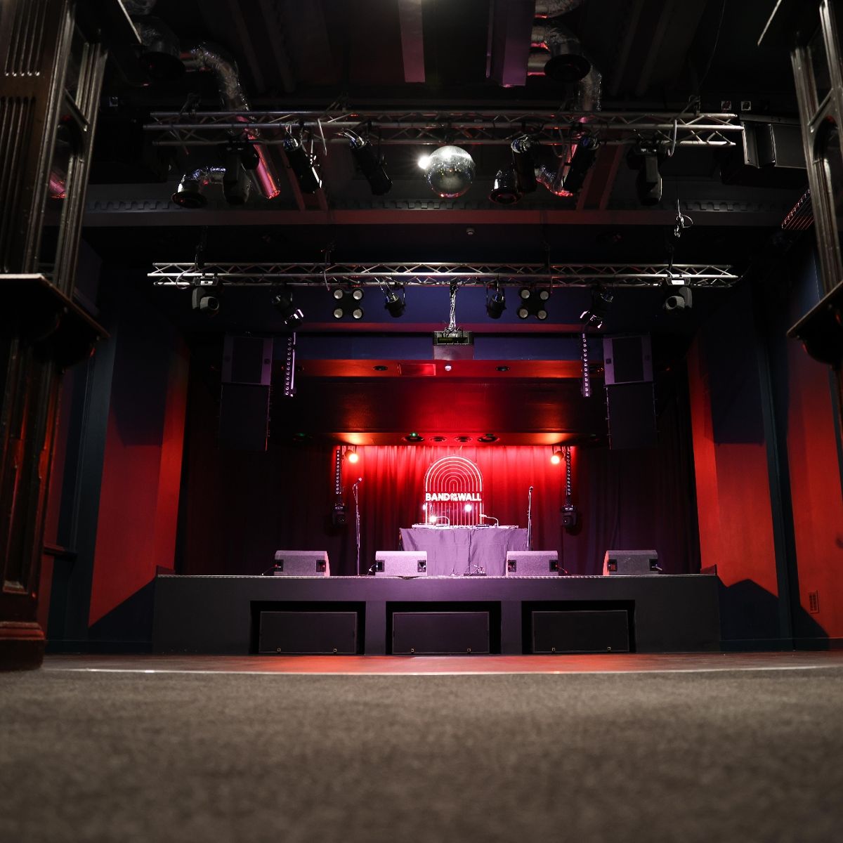 Band on the Wall stage with professional lighting and sound for live events and corporate showcases.