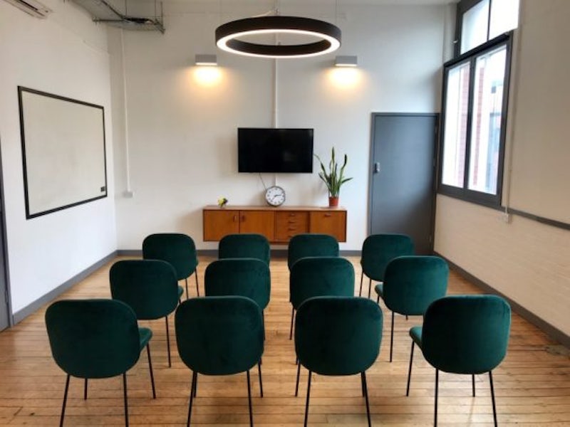 Nisbet Meeting Room with theater seating: boardroom venue for workshops and corporate presentations.