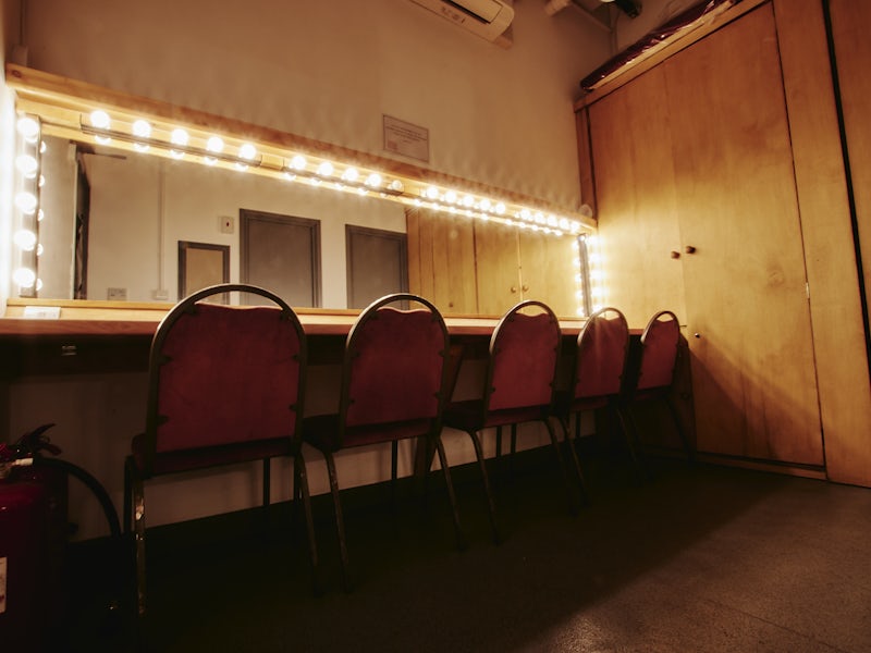 Spielman Theatre backstage dressing room with vanity lights for event production and staging.