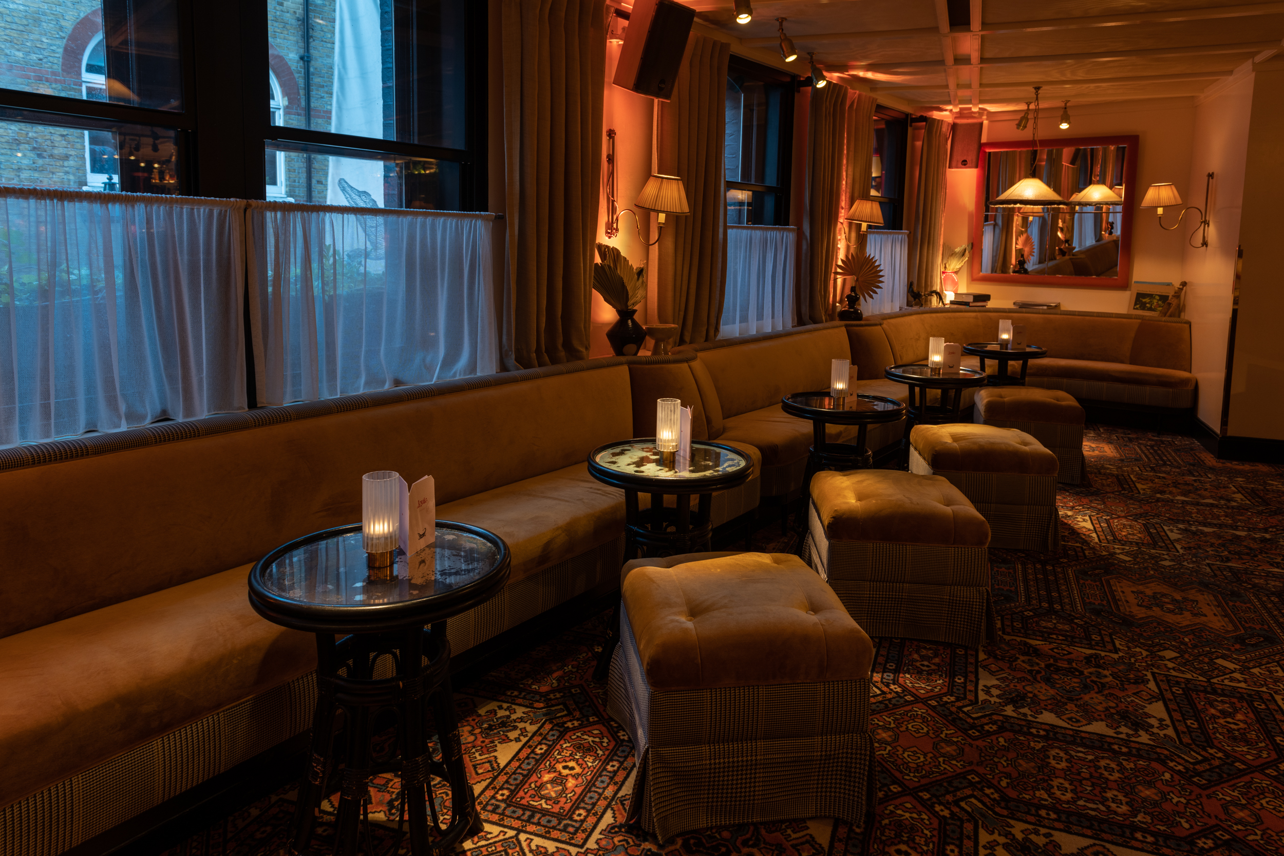 Louie Restaurant event space with plush seating, ideal for cocktail receptions and gatherings.