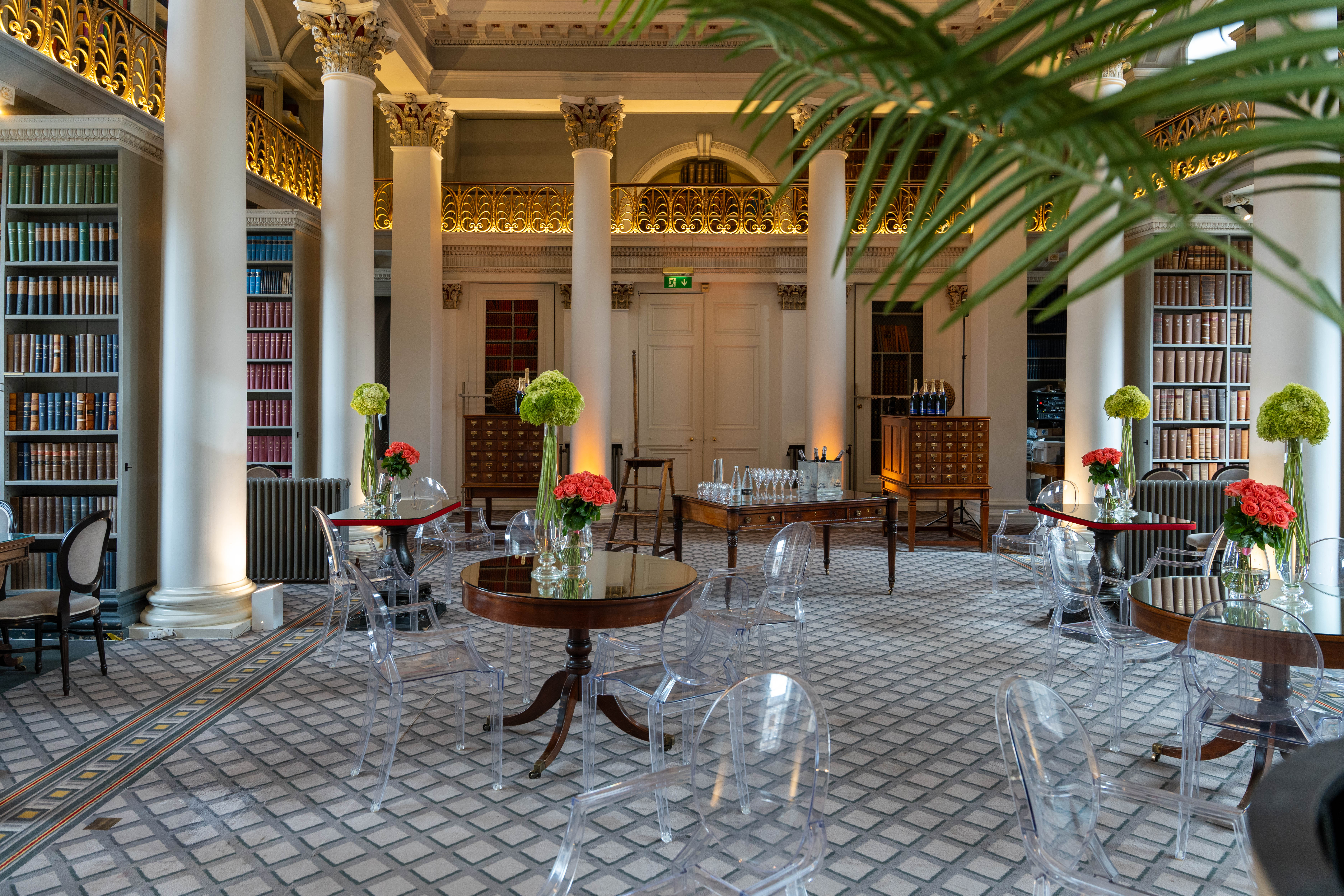 Elegant event space in Signet Library with floral centerpieces, ideal for receptions.