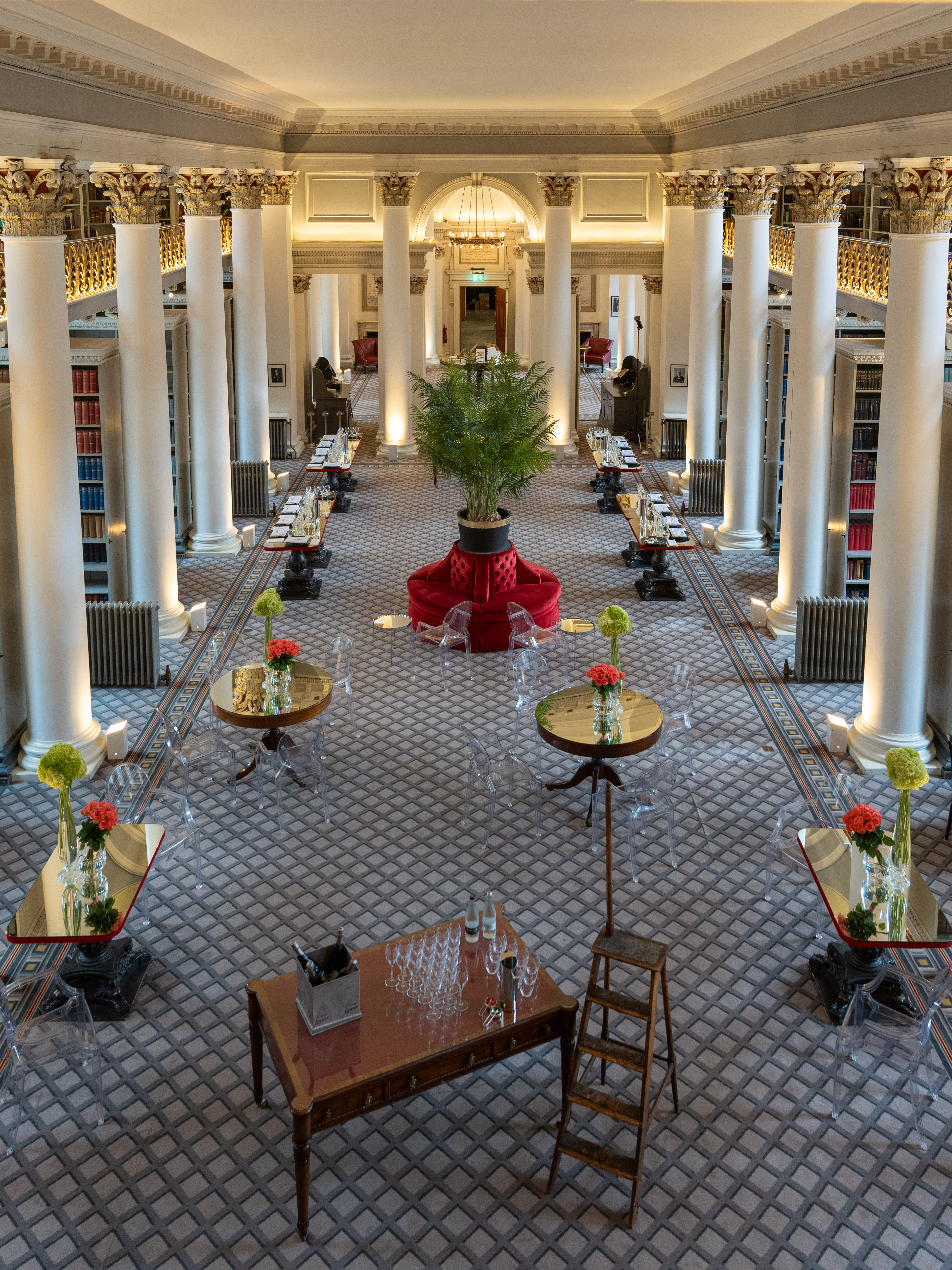 Elegant meeting setup in Signet Library with floral centerpieces and modern decor.