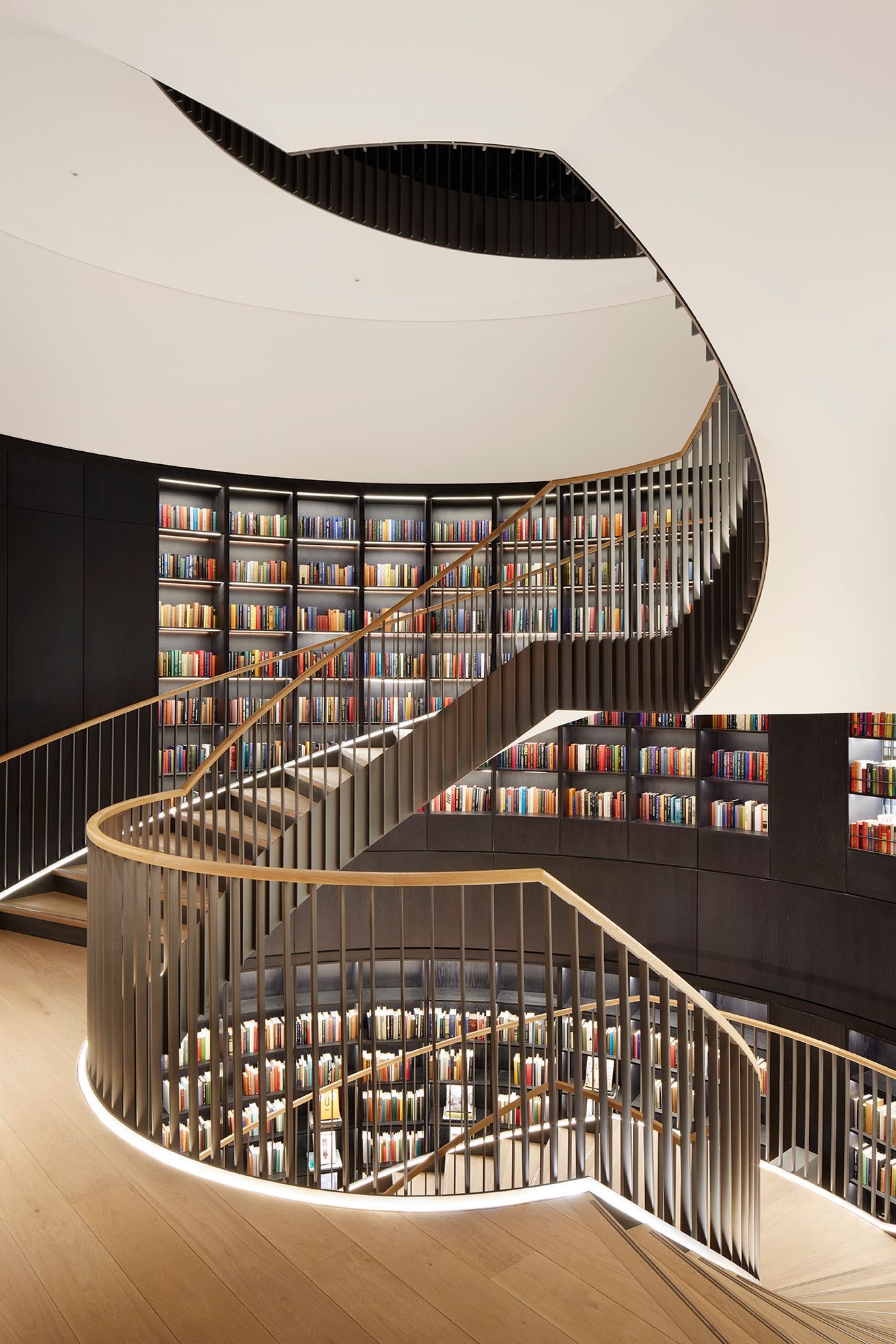 Elegant spiraling staircase in The Forum Event Suite, ideal for networking and meetings.