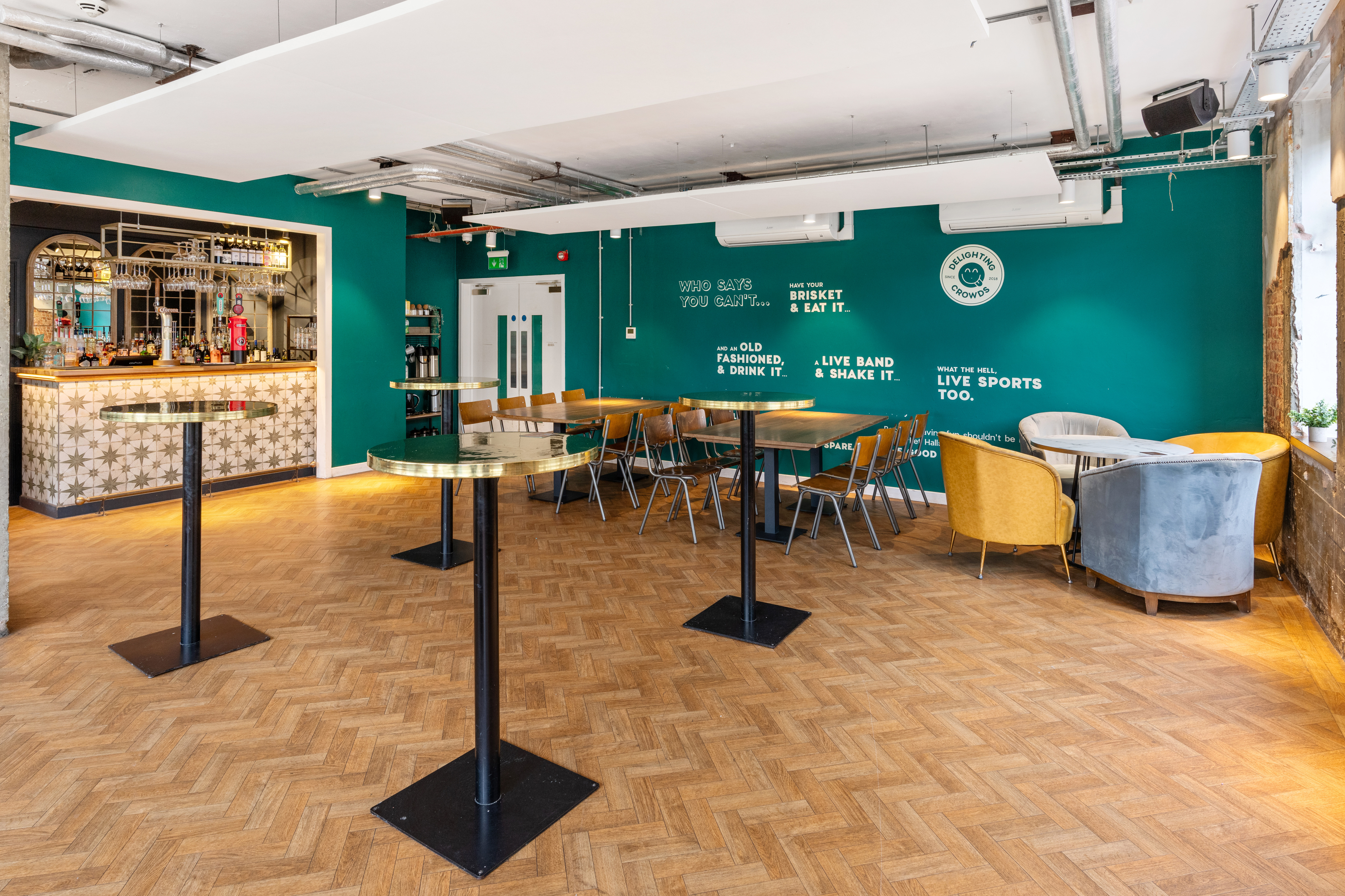 Private Events Room at The Cavendish, vibrant teal walls for networking and gatherings.