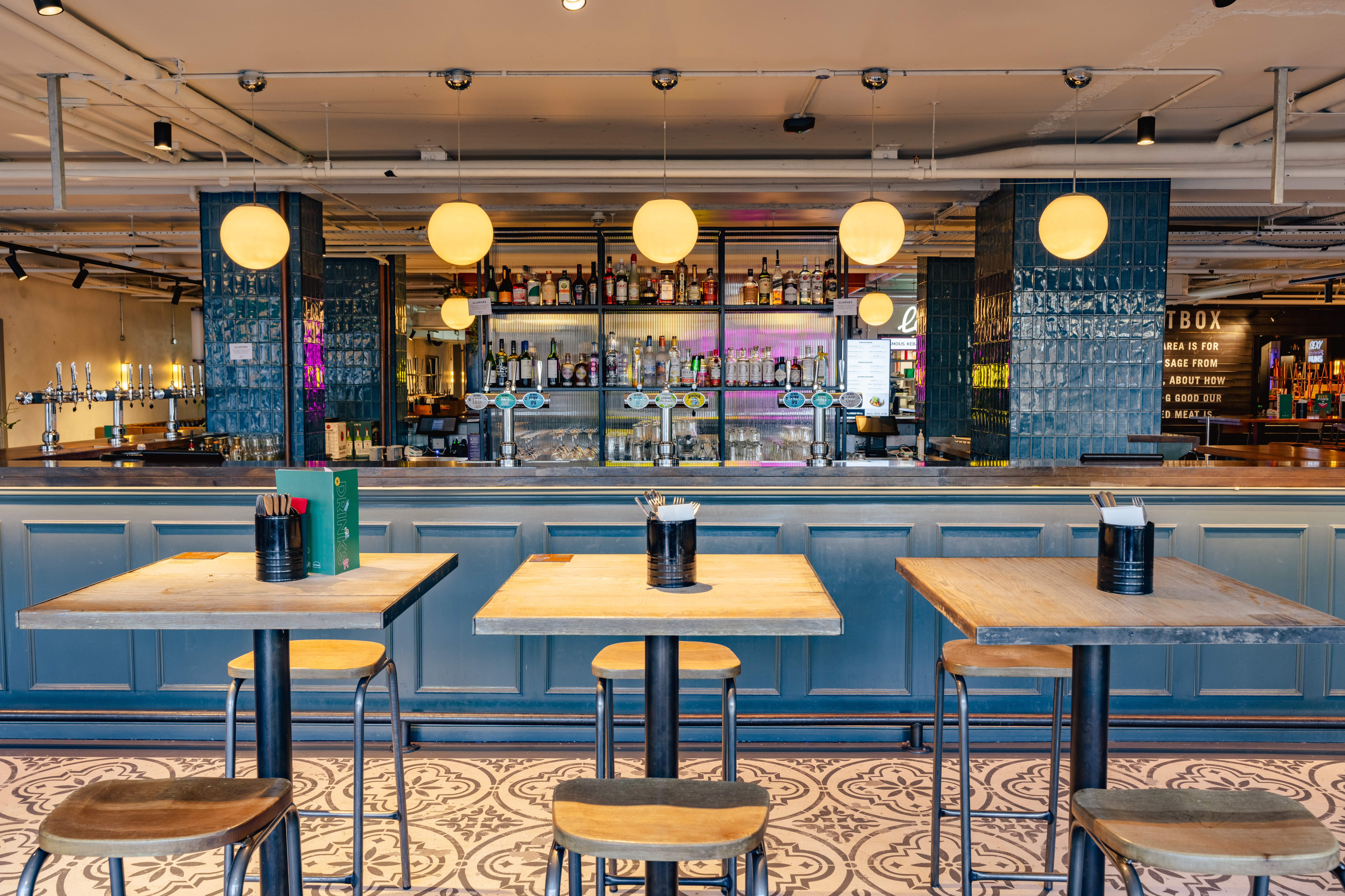 Modern bar area at Market Halls Oxford Street, ideal for events and gatherings.