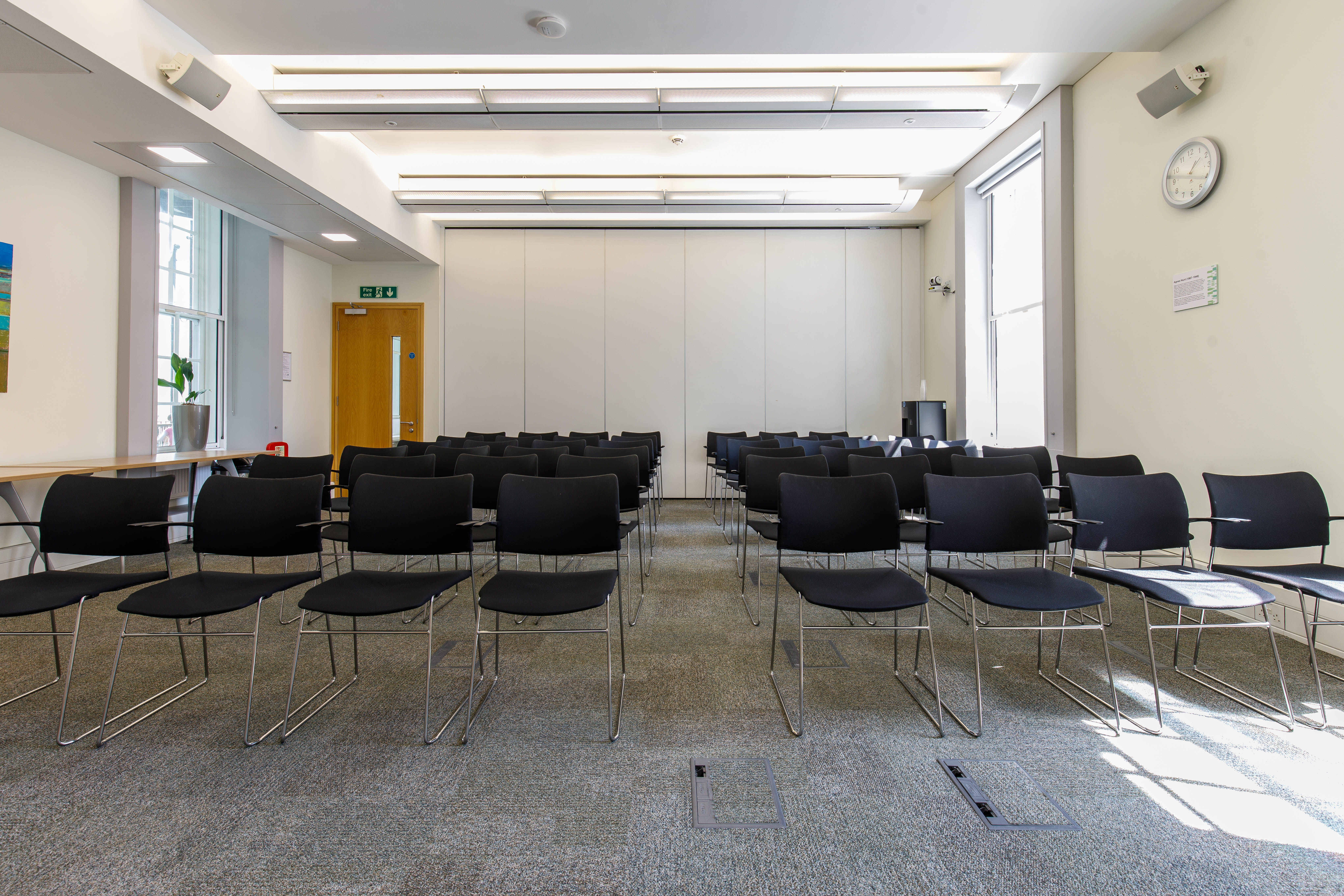 Meeting room at Cavendish Square with black chairs for events and natural light.