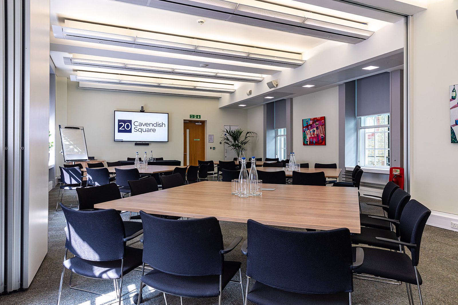 Modern meeting room with large round table for collaborative discussions at 20 Cavendish Square.
