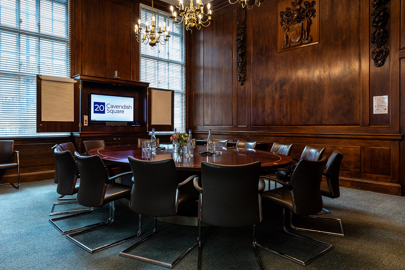 Elegant meeting room with rich wood paneling, perfect for strategic planning sessions.