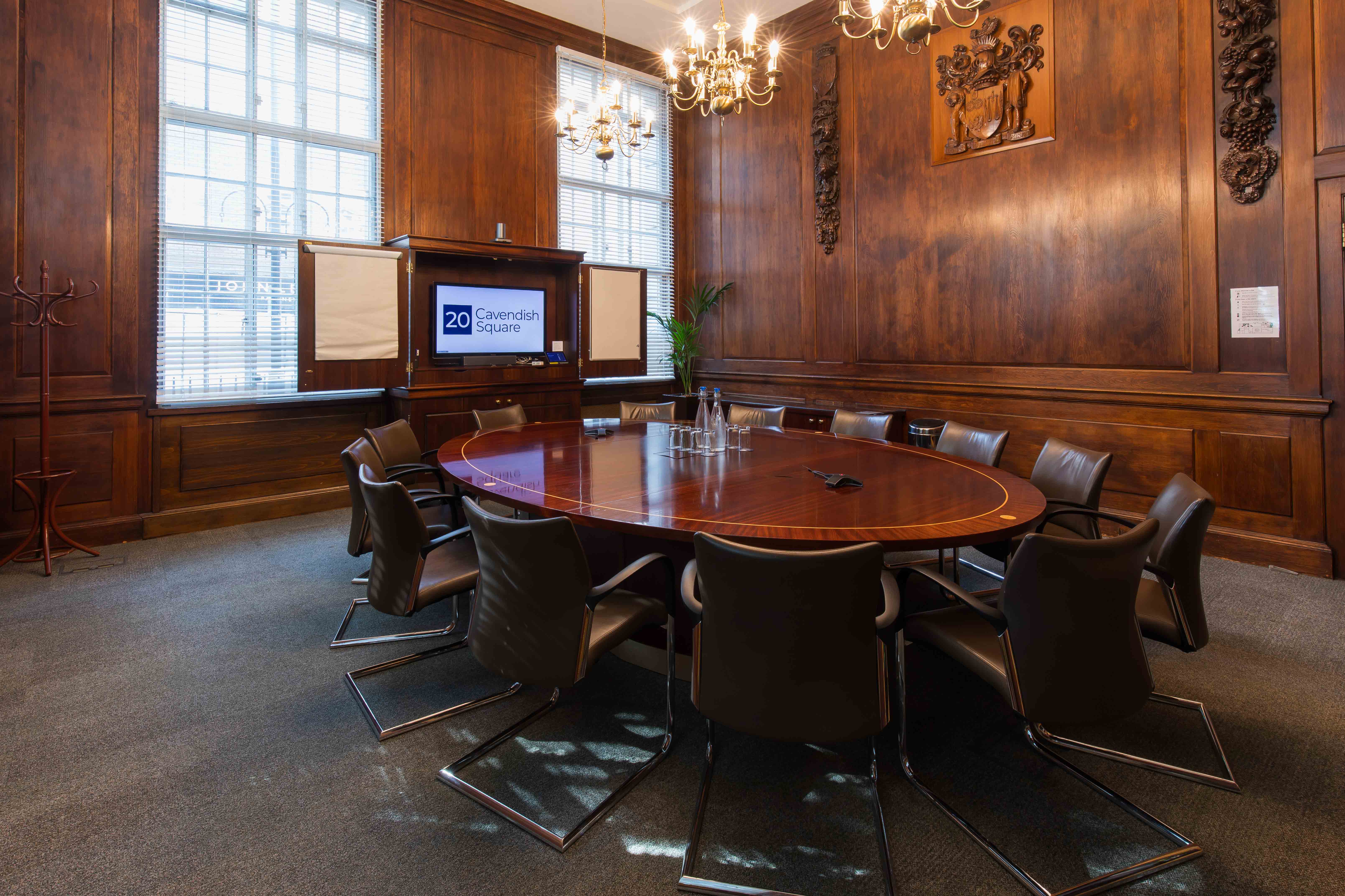 Sarah Swift in a sophisticated conference room with an oval table for executive meetings.