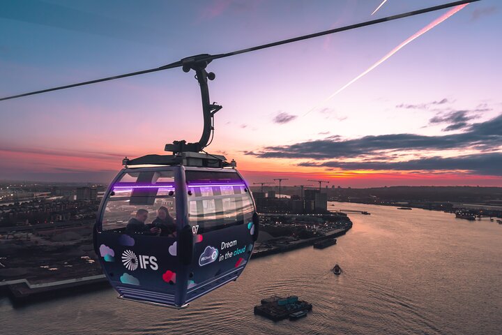 Cable car cabin over river at sunset, ideal for events and team-building activities.