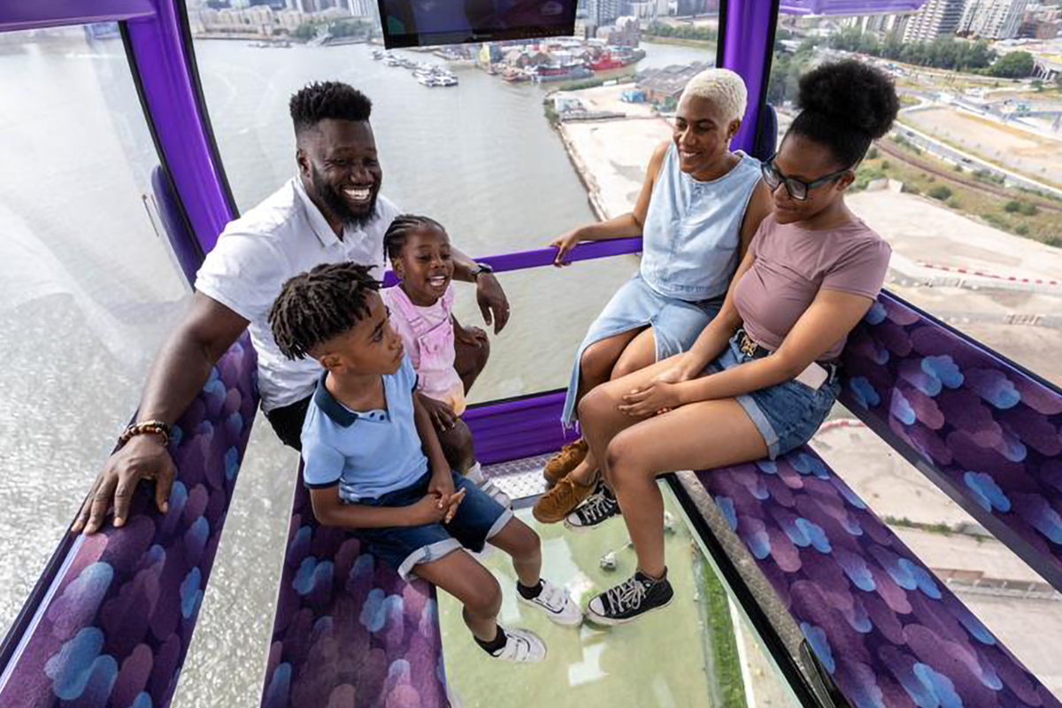 Cable car cabin in London with families, perfect for team-building events.