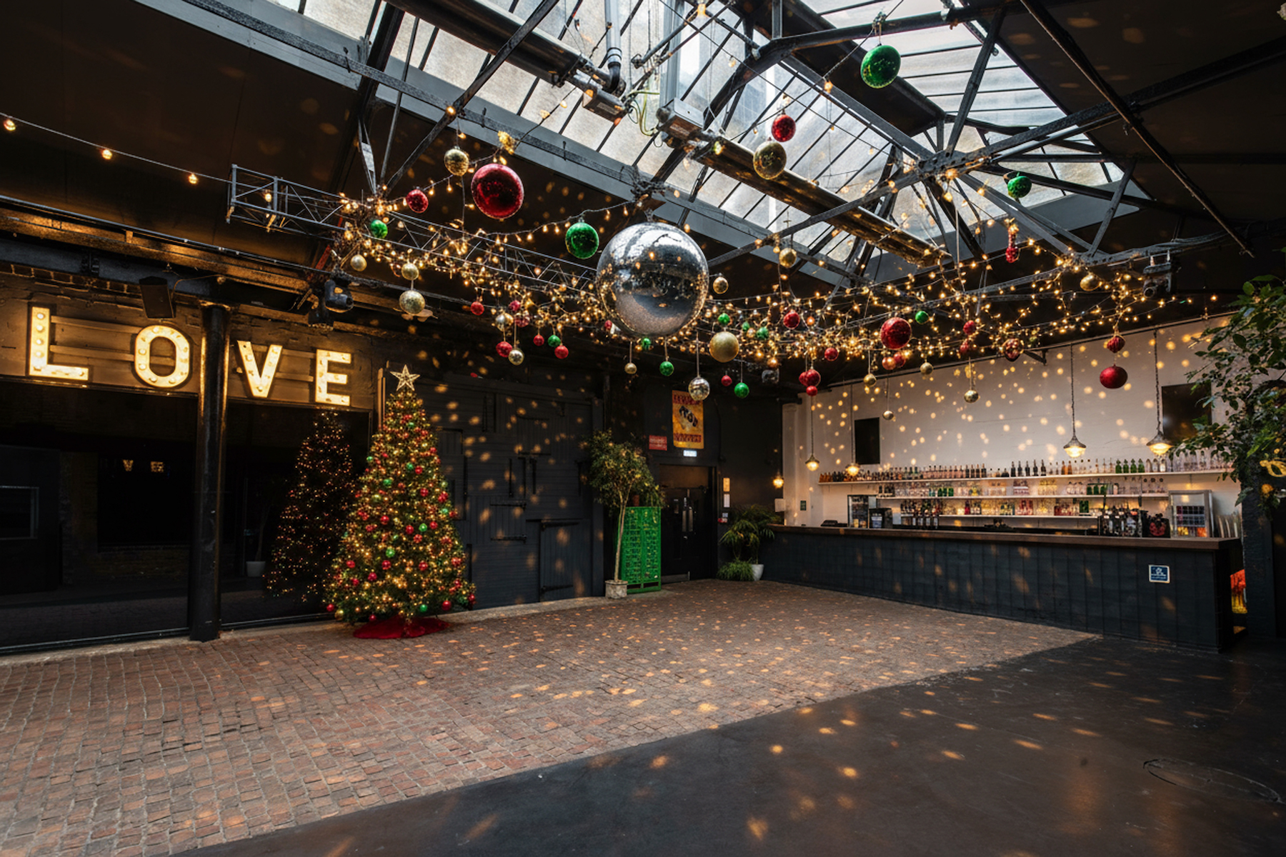 Versatile event space in Electrowerkz with Christmas tree, ideal for weddings and parties.