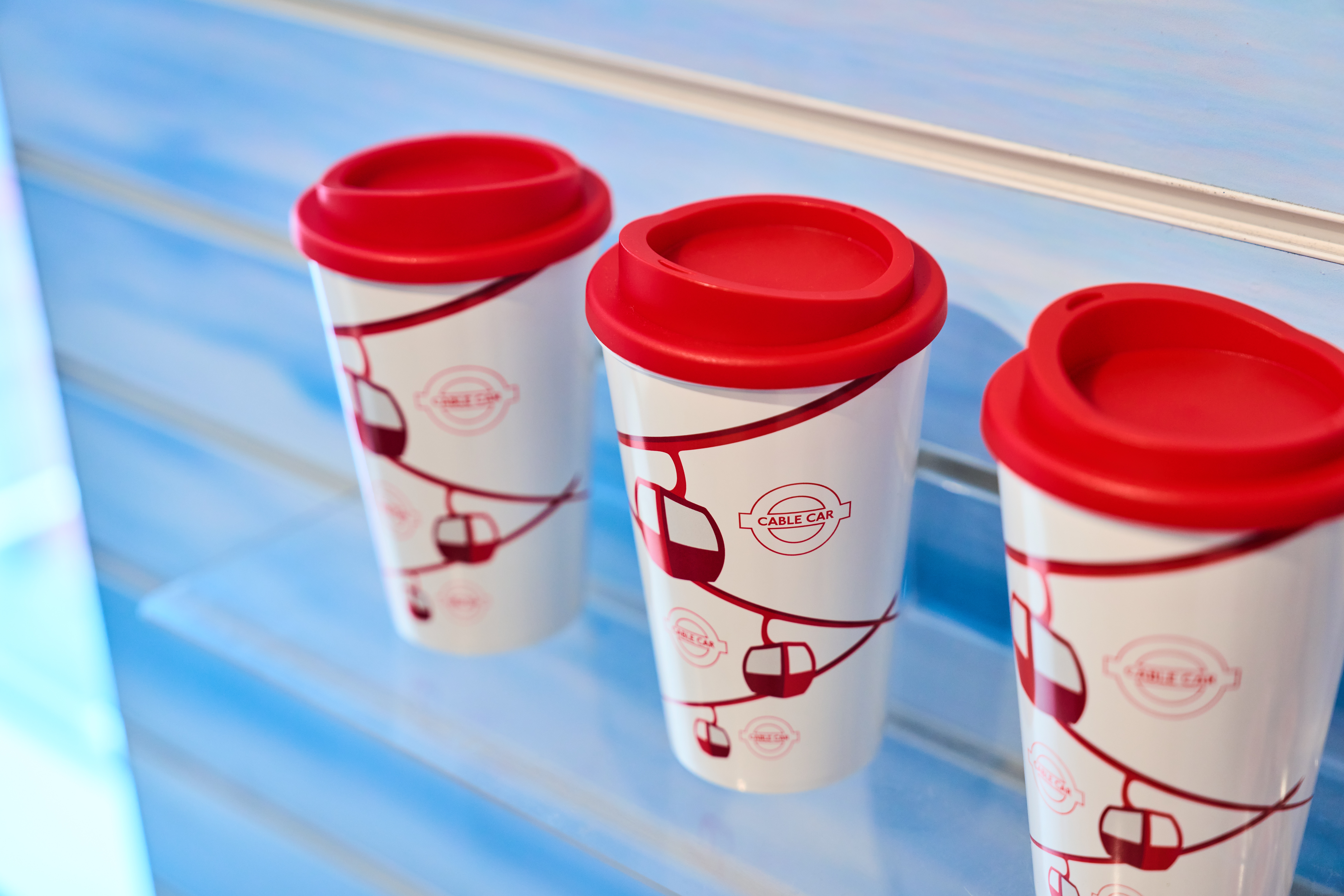Branded coffee cups at London Cable Car, enhancing networking at events.