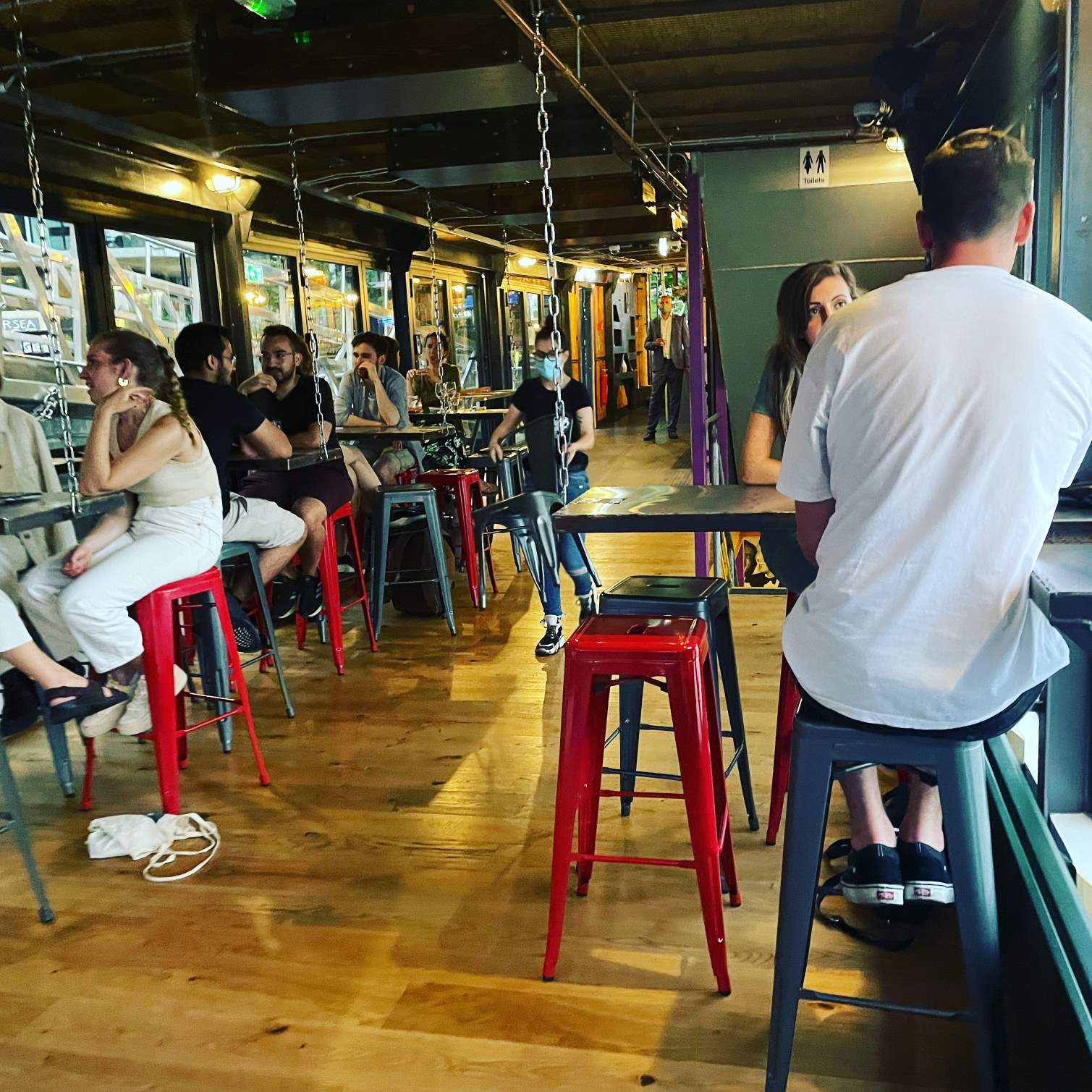 Indoor Middle Deck at Battersea Barge: vibrant venue, industrial decor for networking events.