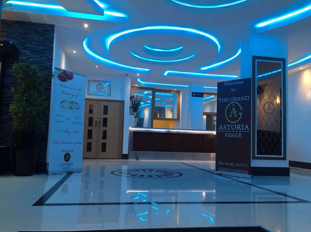 Corporate event venue entrance with sleek lighting, ideal for weddings and celebrations.