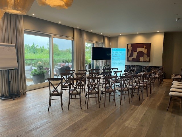 Meeting space at The Reserve in The Lakes with wooden chairs for corporate events.