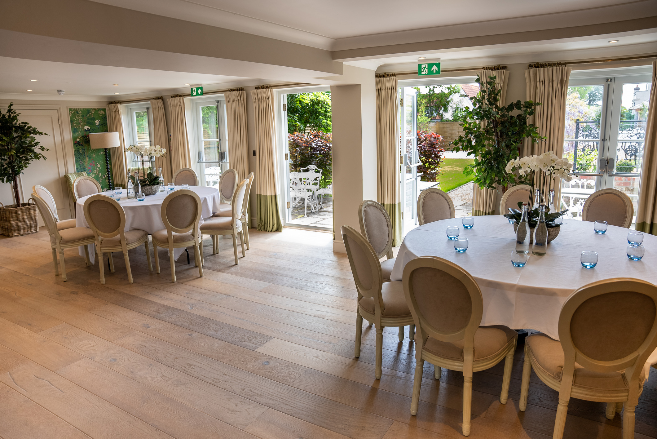 Elegant events room with large windows, perfect for gatherings or meetings.