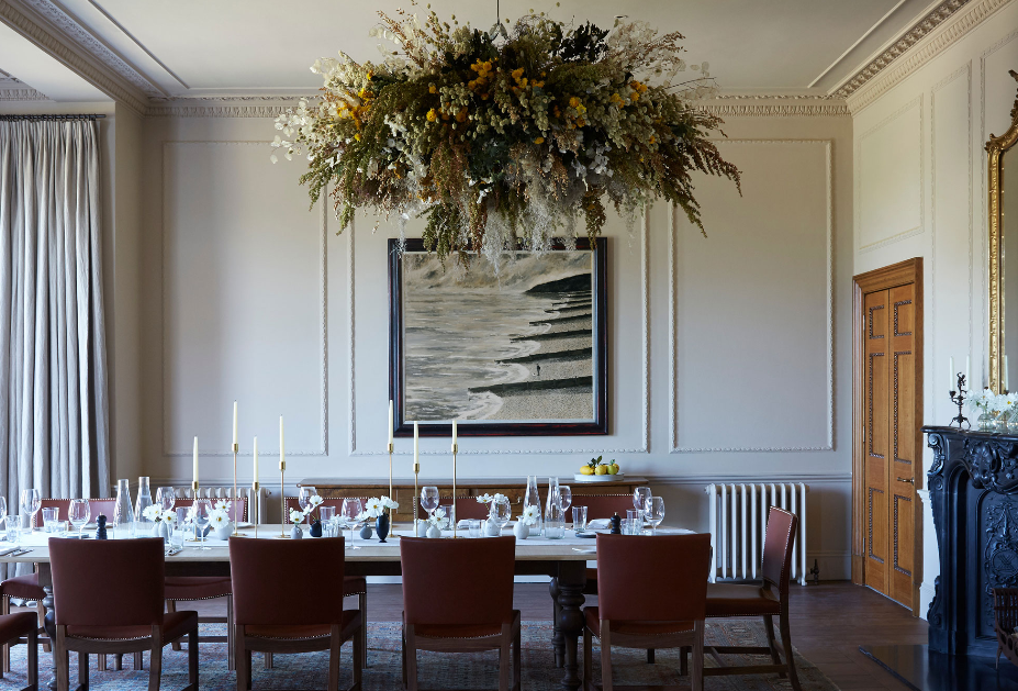 Elegant Assembly Room at Heckfield Place, featuring a long dining table for meetings.
