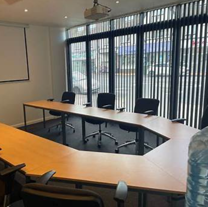 Modern conference room in The Vault Morden with ergonomic chairs for meetings.