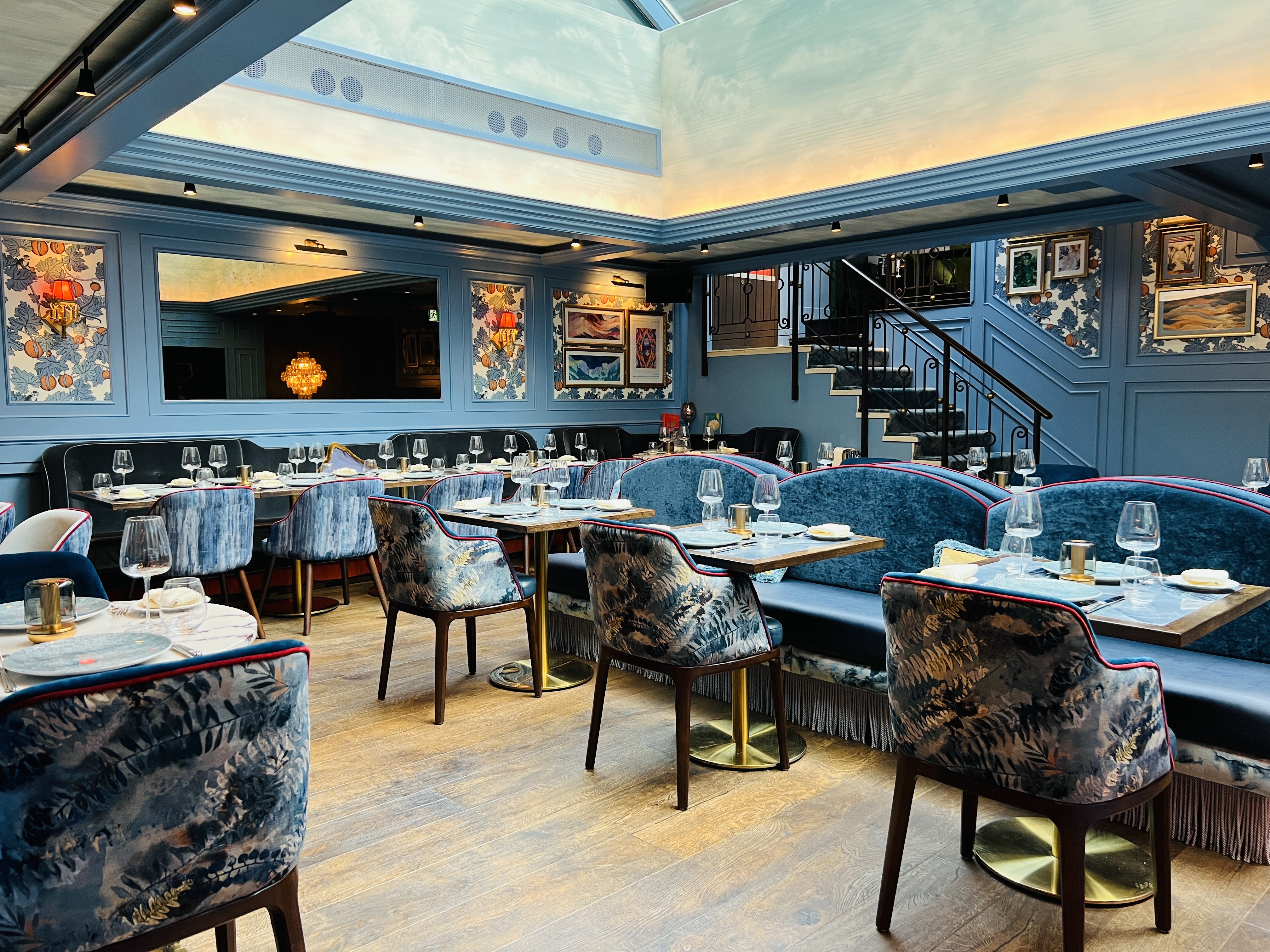 Ridge Room at VATAVARAN: Blue-toned venue for corporate dinner and networking events.