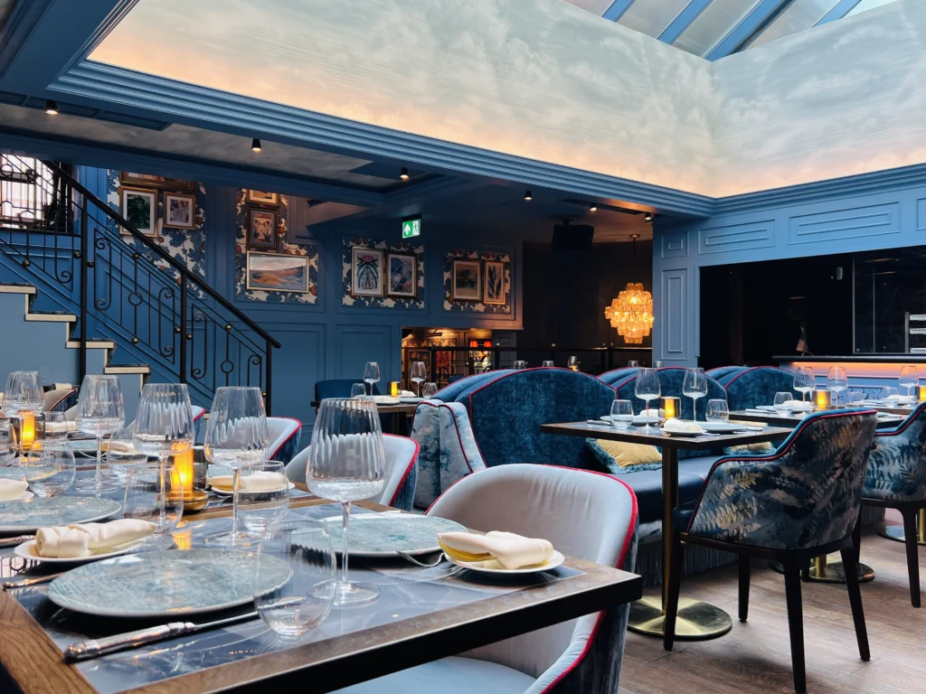 Ridge Room at VATAVARAN: Sophisticated tiered seating for corporate dinners and networking events.