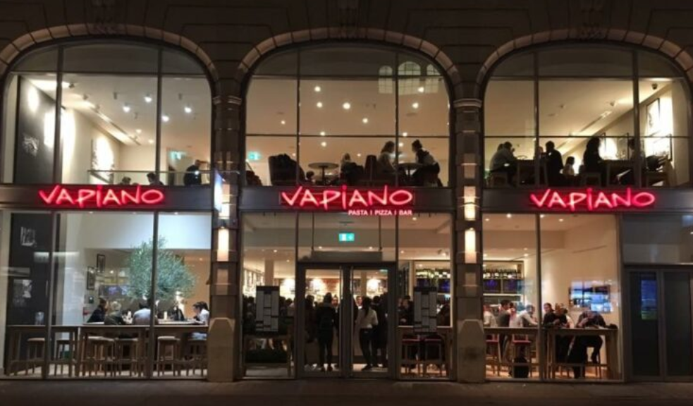 Vibrant Vapiano restaurant exterior, modern design, ideal for team lunches or social events.