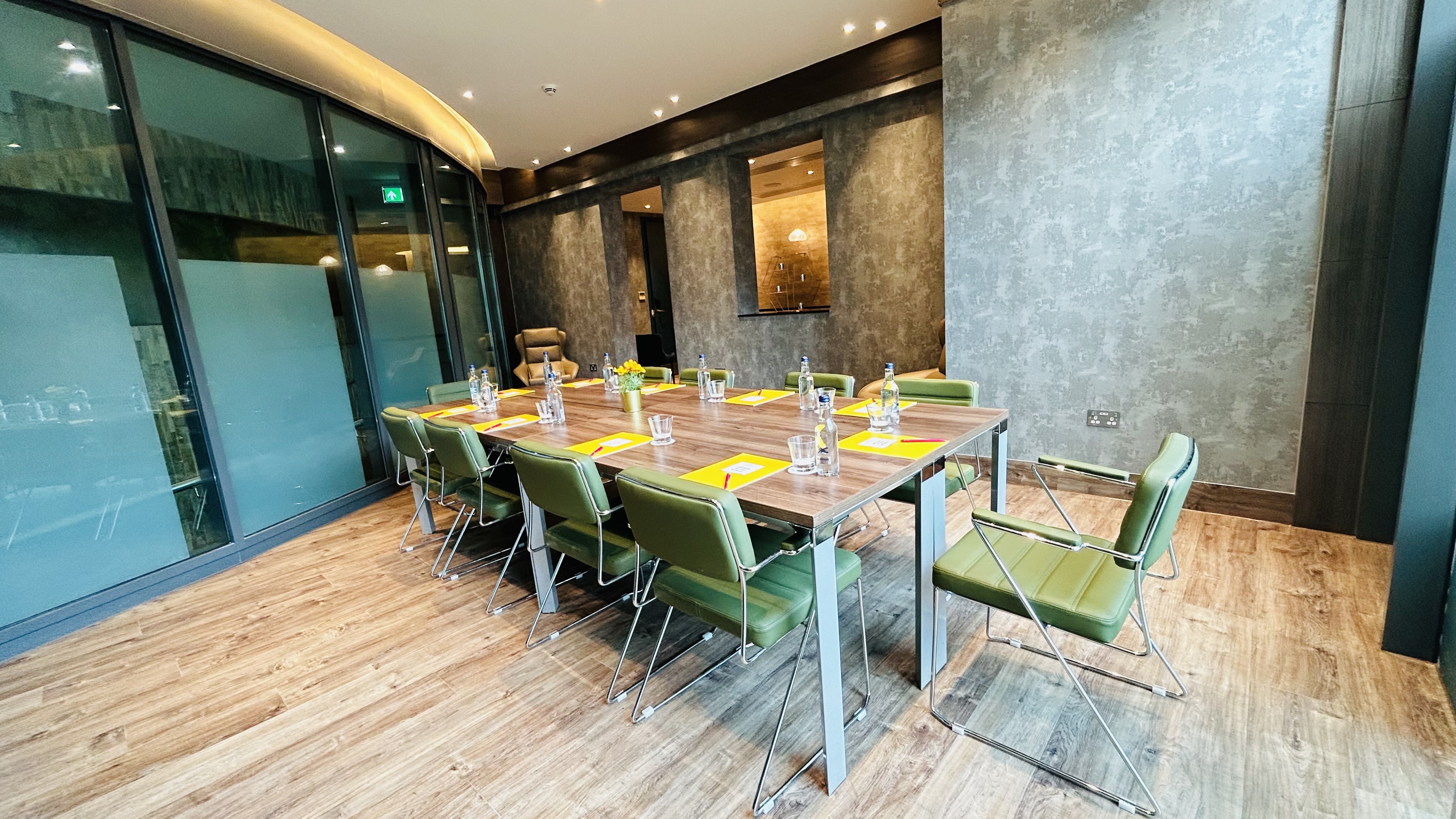 Modern conference room with large table in Crowne Plaza London Kingston for meetings and workshops.