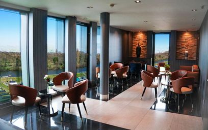 Elegant Sky Lounge at Crowne Plaza Kingston with panoramic windows, ideal for events and networking.