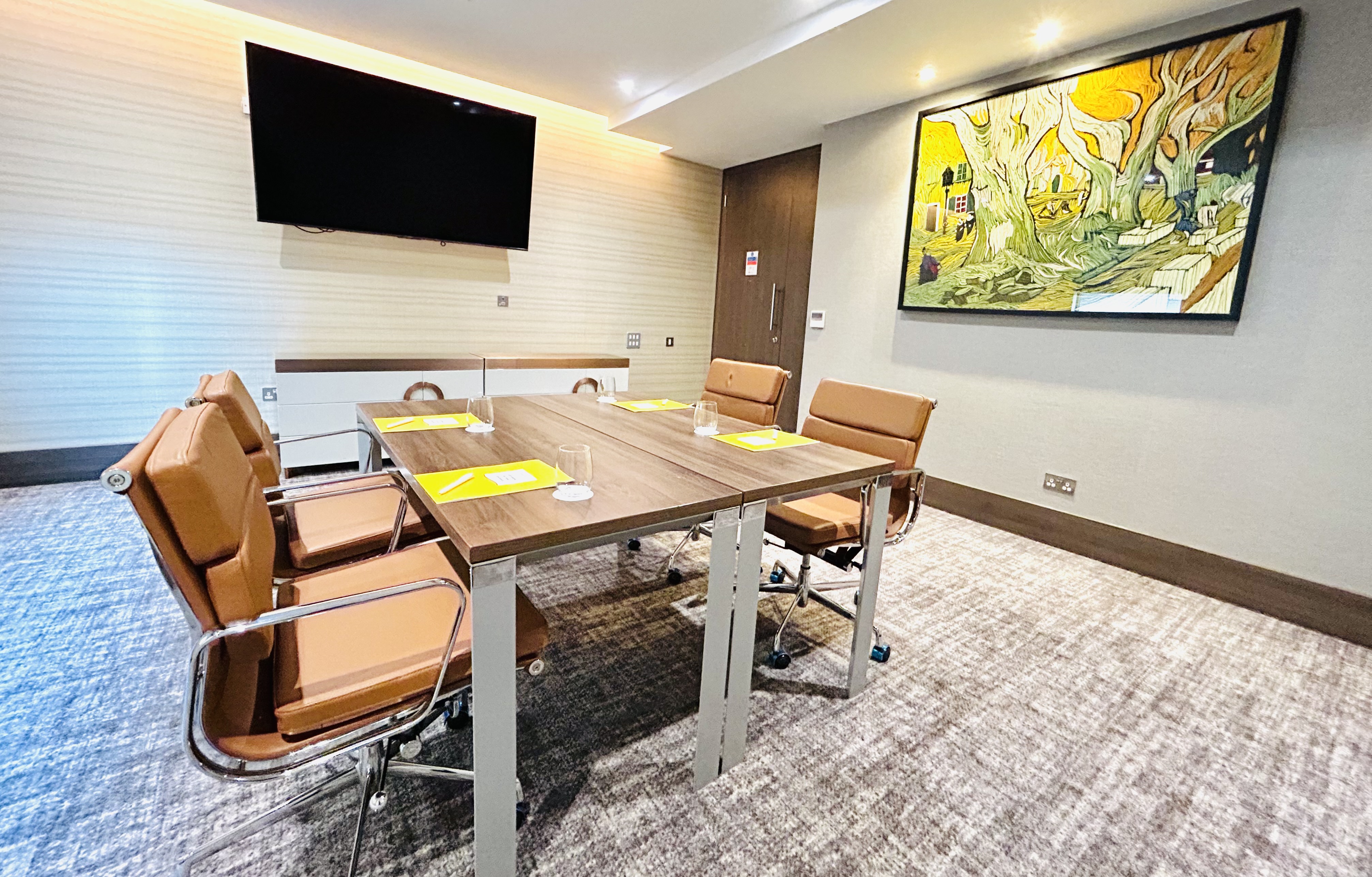 Richmond Suite at Crowne Plaza London Kingston, sleek conference table for corporate meetings.