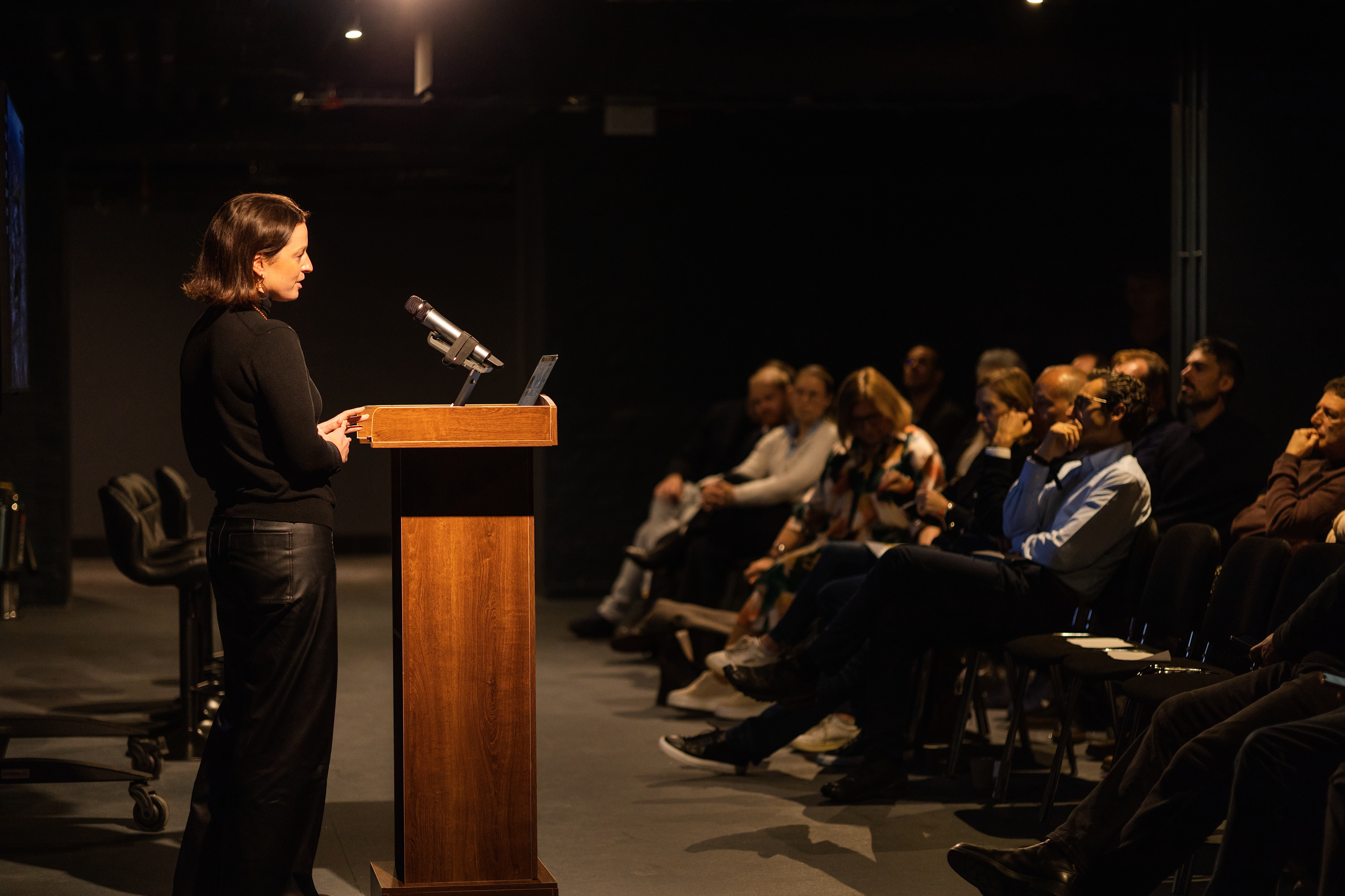 SPYSCAPE SPYGAMES event theater, focused lighting, audience engagement.