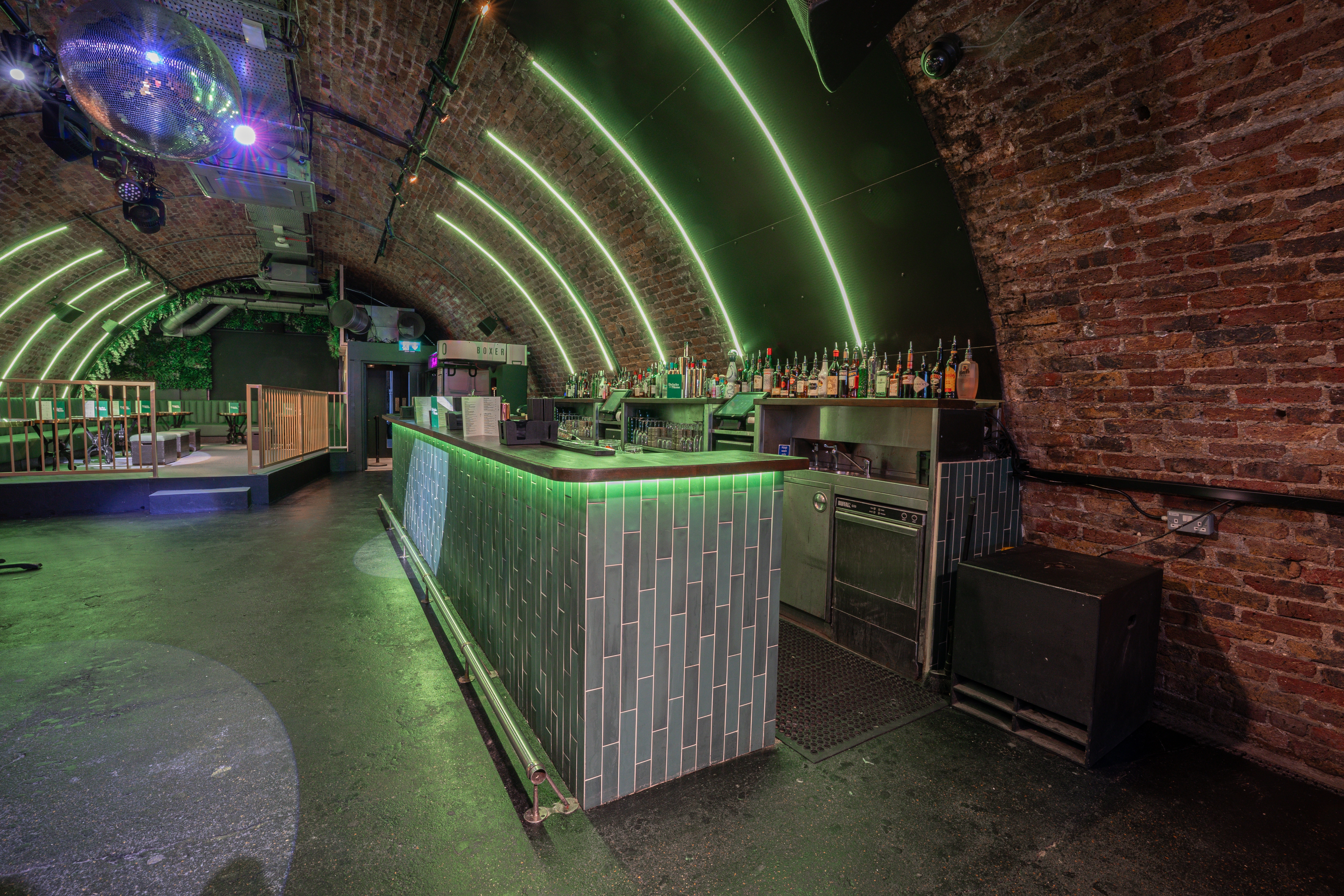 Sleek industrial venue DUO London with brick archways, perfect for vibrant events.