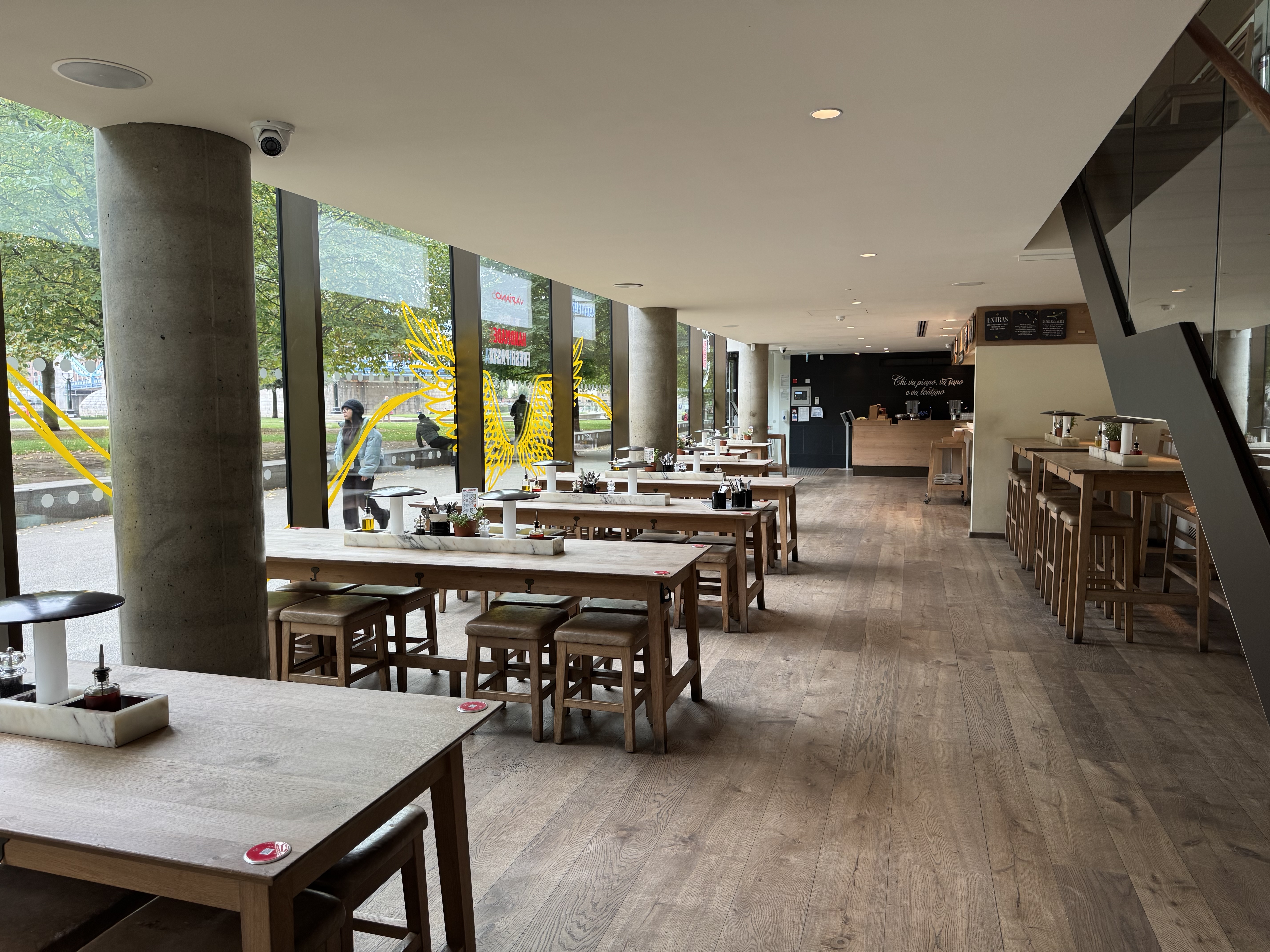 Modern pizza kitchen venue with natural light for informal meetings and networking events.