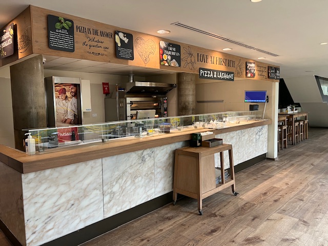 Modern pizza kitchen at Vapiano Tower Bridge, ideal for events and networking.