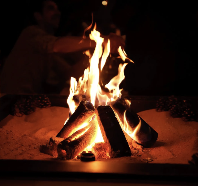 "Cozy fire at Yuletide Bar, perfect for outdoor events and gatherings."