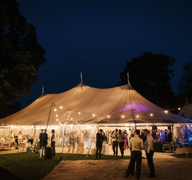 Elegant tent venue hire for weddings and galas, softly illuminated under the stars.