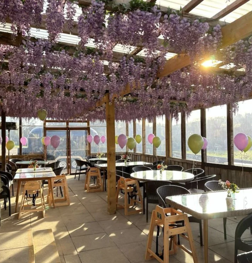 Charming floral canopy in Walled Garden West Wycombe, perfect for weddings and events.