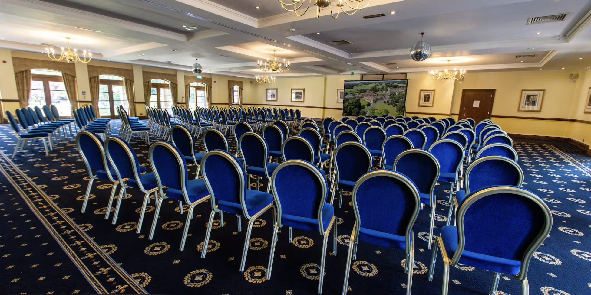Albrighton Suite conference room with blue chairs for corporate events and presentations