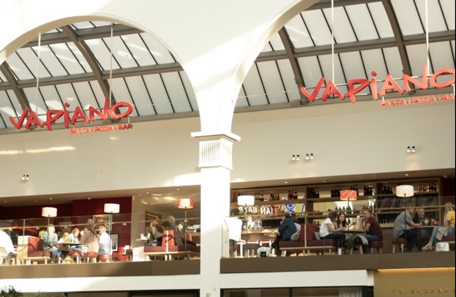 Vapiano Manchester: modern restaurant with communal seating for casual networking events.