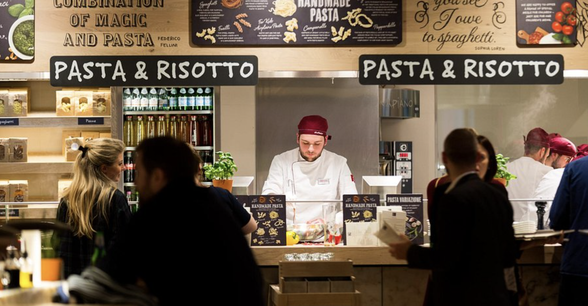 "Vibrant Vapiano food station with chef serving fresh pasta for events and gatherings"